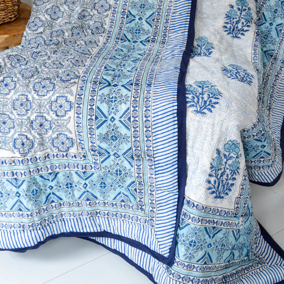 blue hand blocked quilt with reverse side made from organic cotton hand block printed in india 