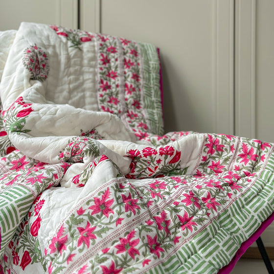 Vibrant hand block printed Indian quilts showcasing intricate patterns and traditional craftsmanship